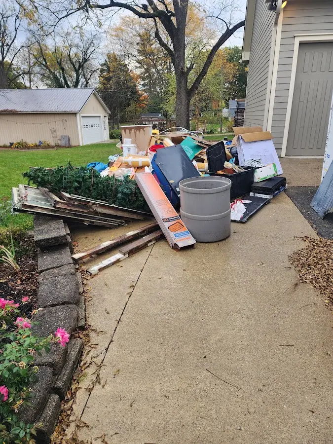 Dumpster being loaded with debris for 30 Yard Dumpster Rental in Brookhaven